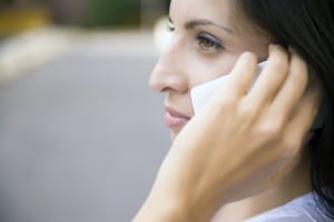 woman on cellphone calling about personalized treatment for young adults