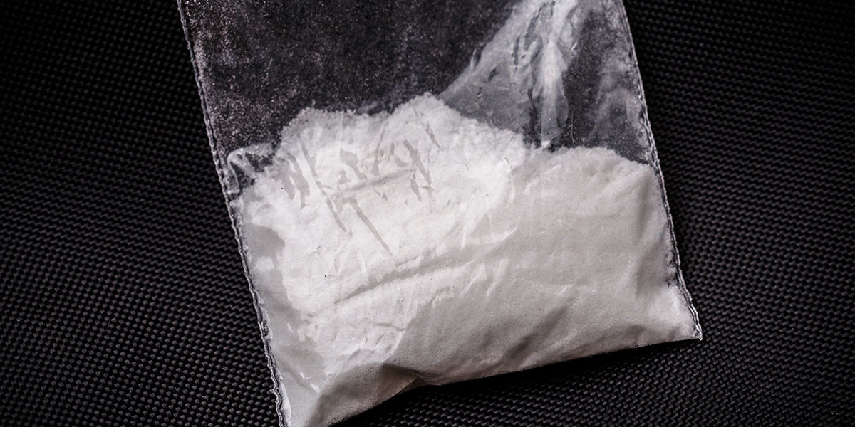 baggie of white powder posing the question what is cocaine