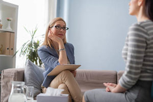 woman participates in therapy at a xanax addiction treatment center