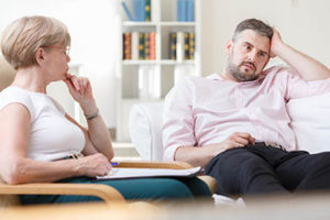 man opens up to his counselor in a meth addiction rehab treatment program for professionals