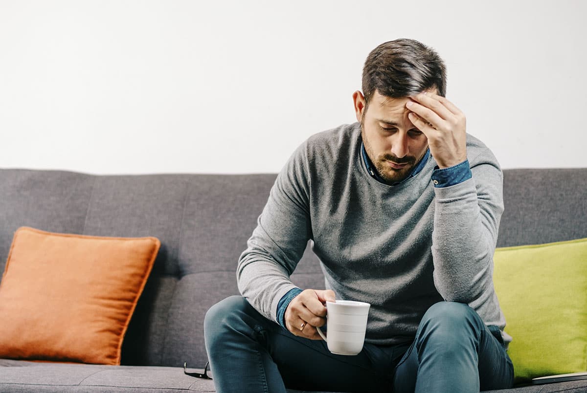 man in recovery drinking tea and willing to change our perspective