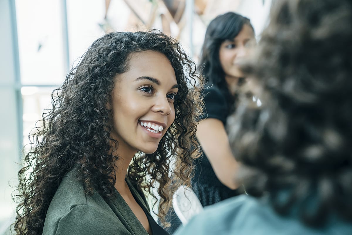 woman smiling at learning what is TMS therapy
