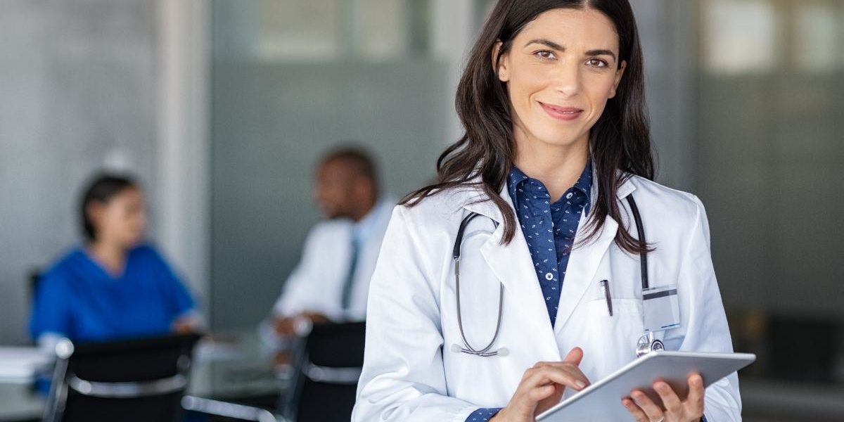 Physician Health Programs for Addicted Doctors a doctor with a clipboard smiles as she considers physician health programs for addicted doctors