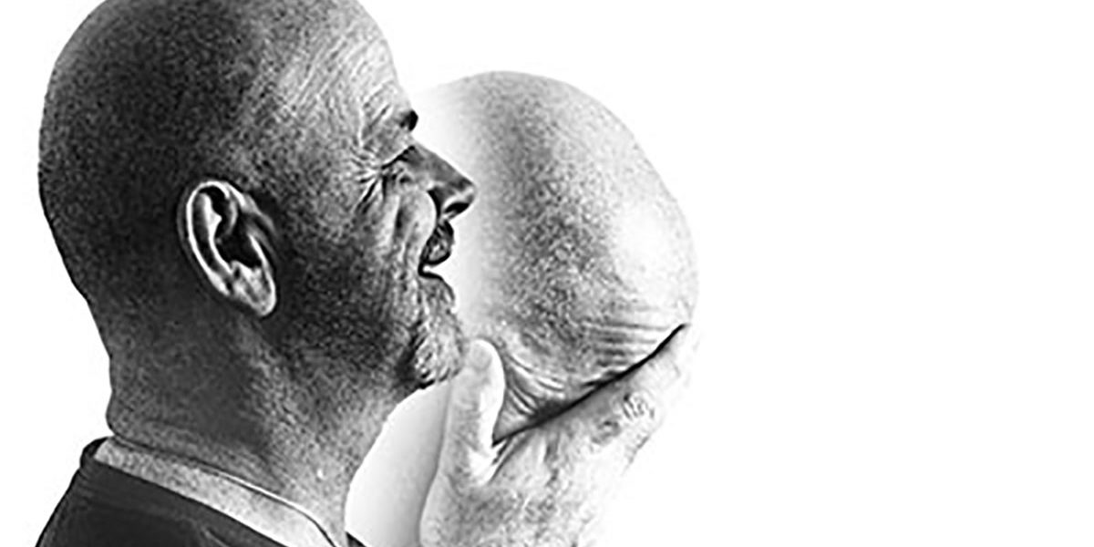 grayscale image of man feeling happy and depressed during common mental health disorders episode