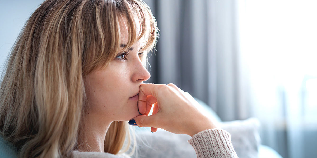 woman struggles thinking about her triggers