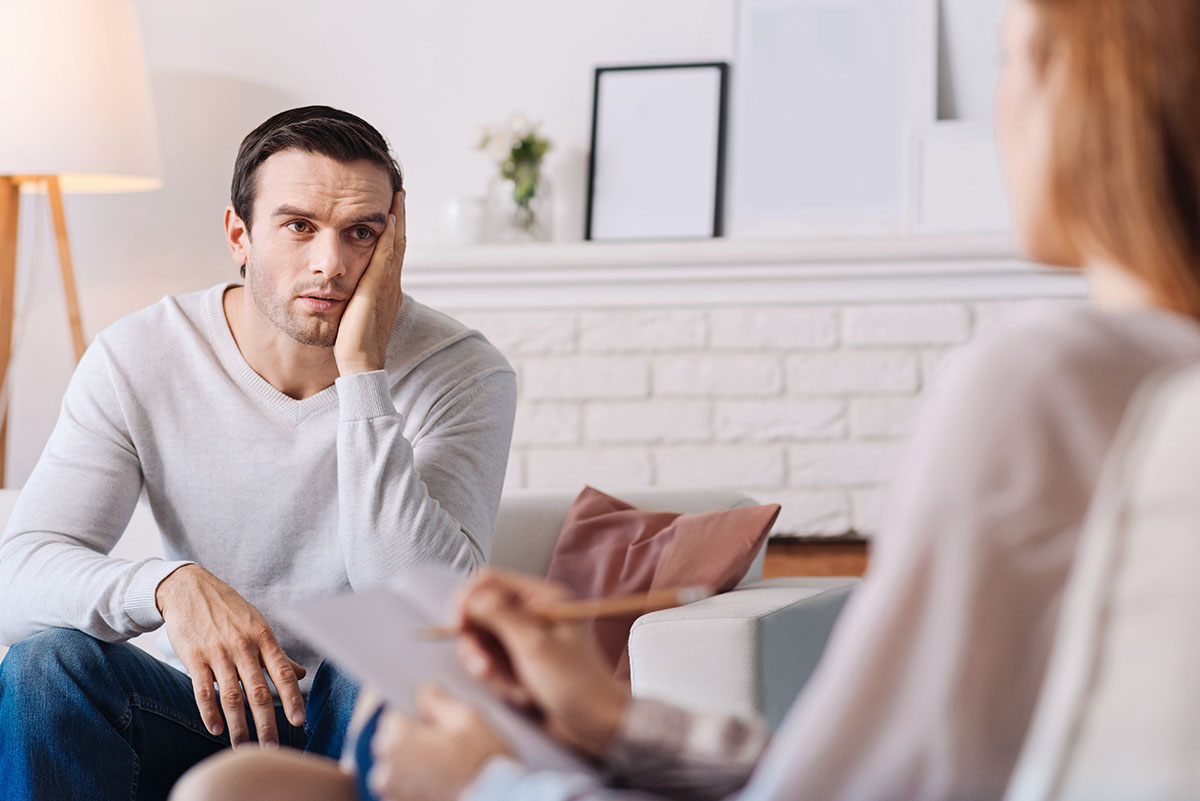confused man listening to therapist explain are cbt and dbt different