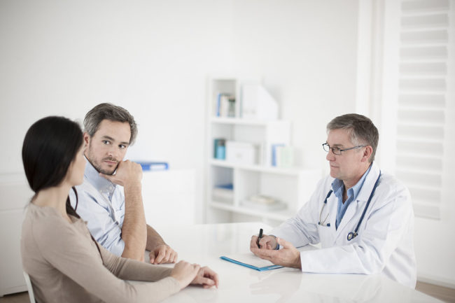 husband and wife asking doctor does my loved one need TMS therapy