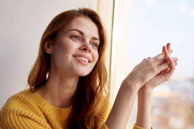 woman smiling after tms therapy in fl for depression
