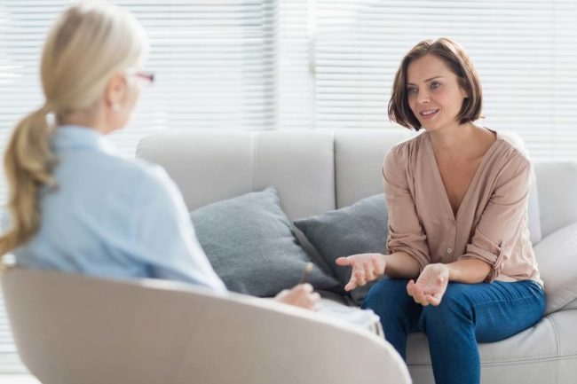 woman asking therapist about the Psychotherapy Definition in Addiction Counseling