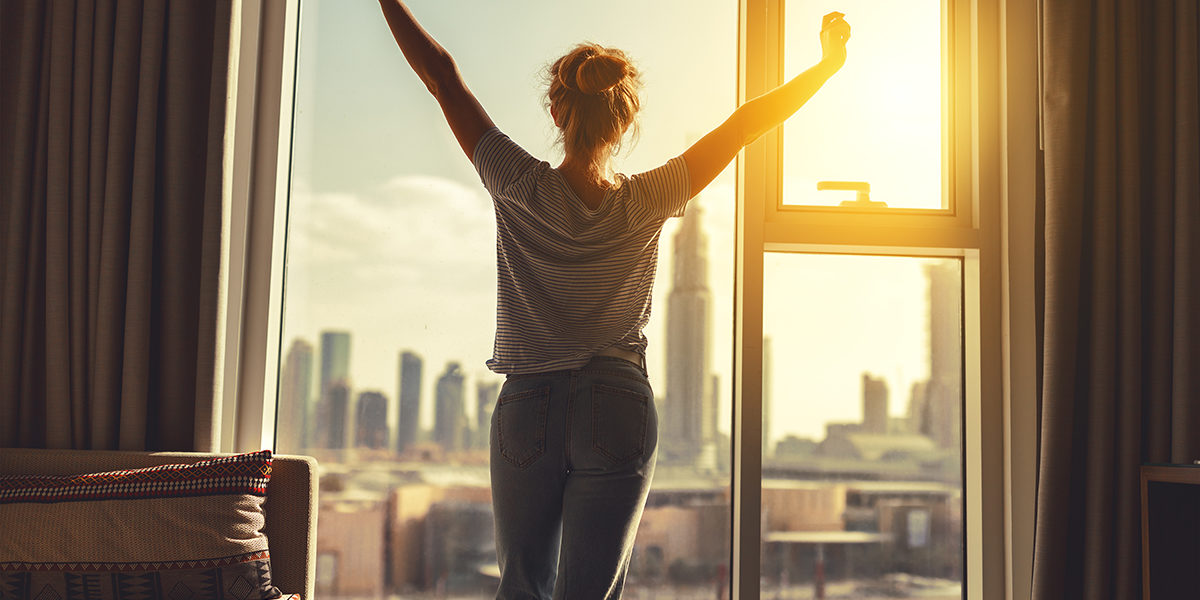 Rehab 101_ Some Reflections on How the Principle of ‘Humility’ Fits into Recovery (1) woman stretching in the morning and using humility in addiction recovery