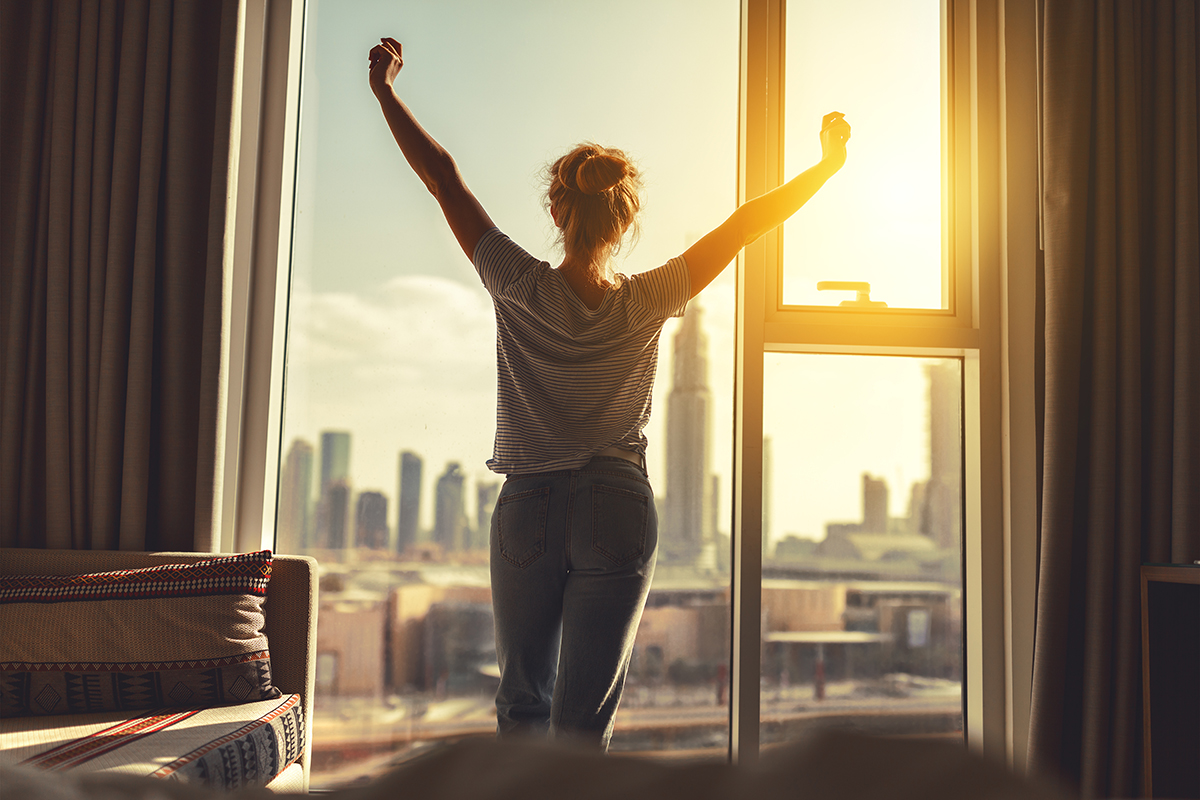 woman stretching in the morning and using humility in addiction recovery