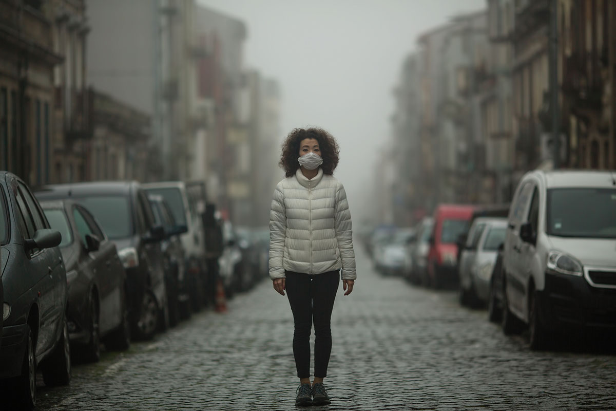 woman walking down street during pandemic worried about overdose deaths
