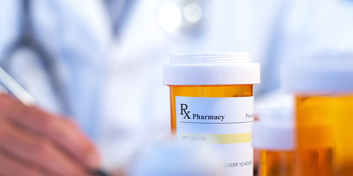 New Report Discloses Dramatic Rise in Doctors & Nurses Stealing Prescription Opiates doctor with prescription bottles showing the process of Stealing Prescription Opiates