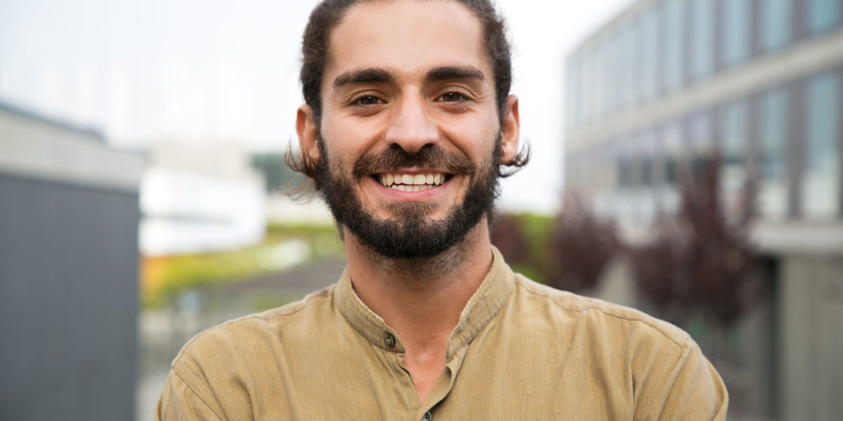 Learning to Care for Our Physical Selves Part one man smiling after learning physical care in recovery