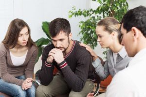 a mans loved ones participate in family therapy with him while he is in addiction treatment 