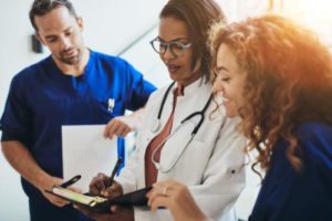 a group of healthcare professionals discuss a drug and alcohol treatment program for physicians