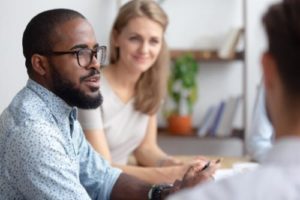 a group of people discuss entering a drug and alcohol treatment program for professionals