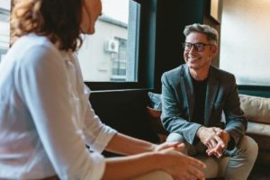 a man discusses tms therapy for professionals near cape coral fl with a friend