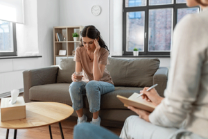 a woman starts to open up in a depression treatment program